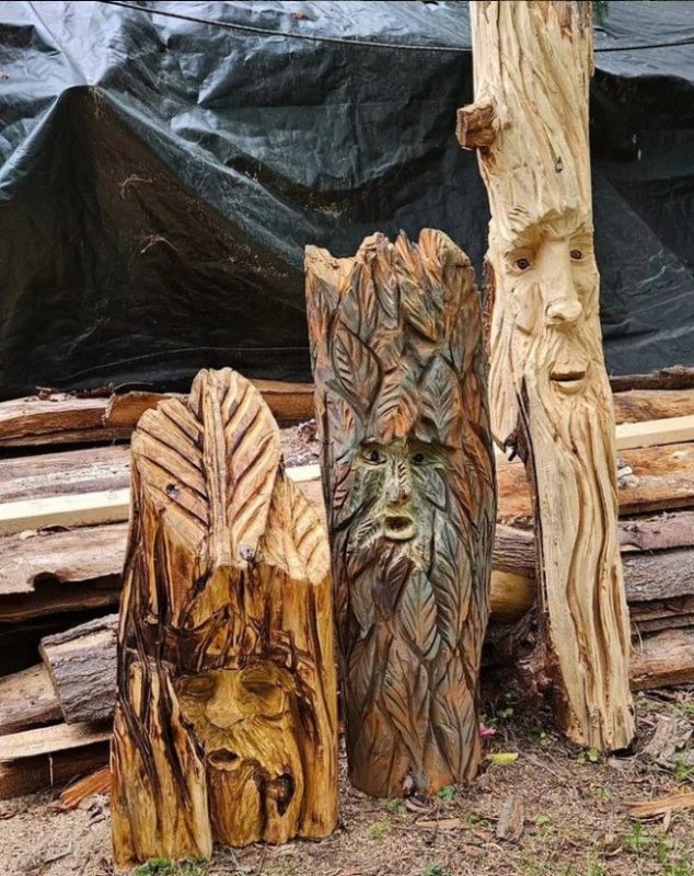 three wind spirit wood carvings