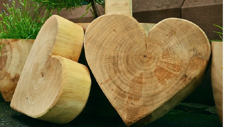 two smooth wood heart carvings